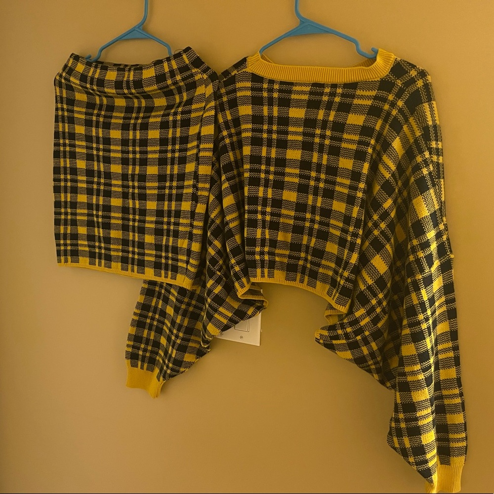 Yellow & black two piece skirt set with a long sleeve sweater.